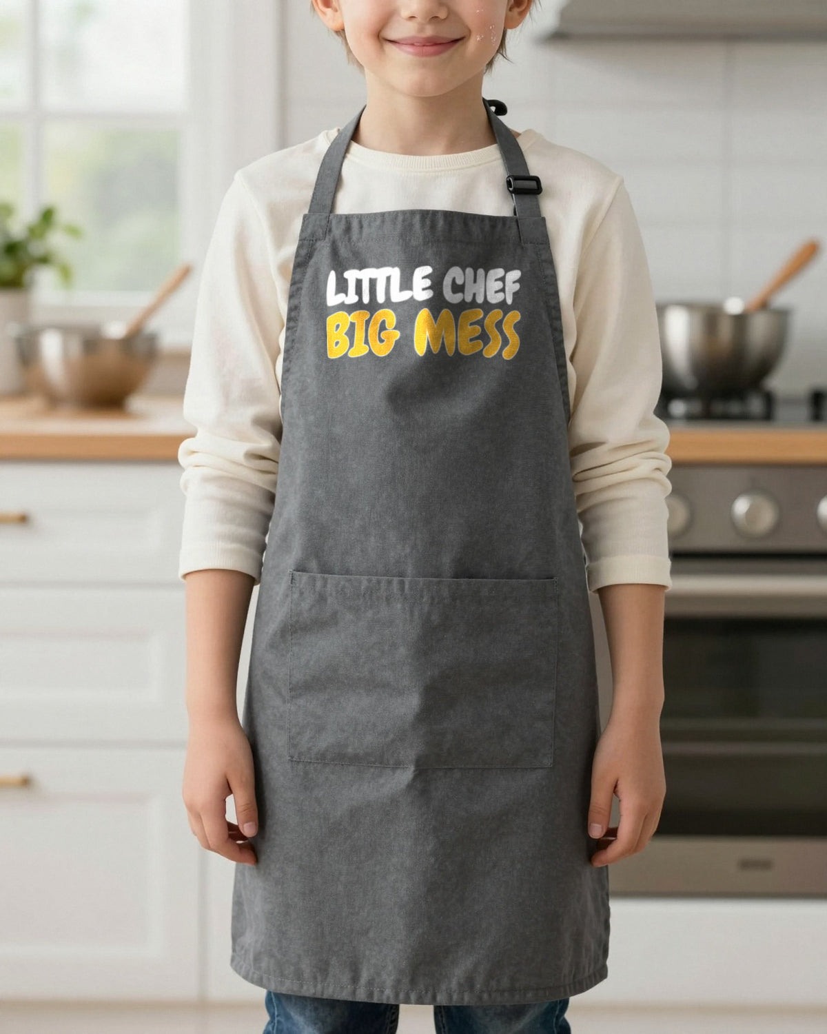 Little Chef Big Mess kids apron in Dark Grey, worn, our photo