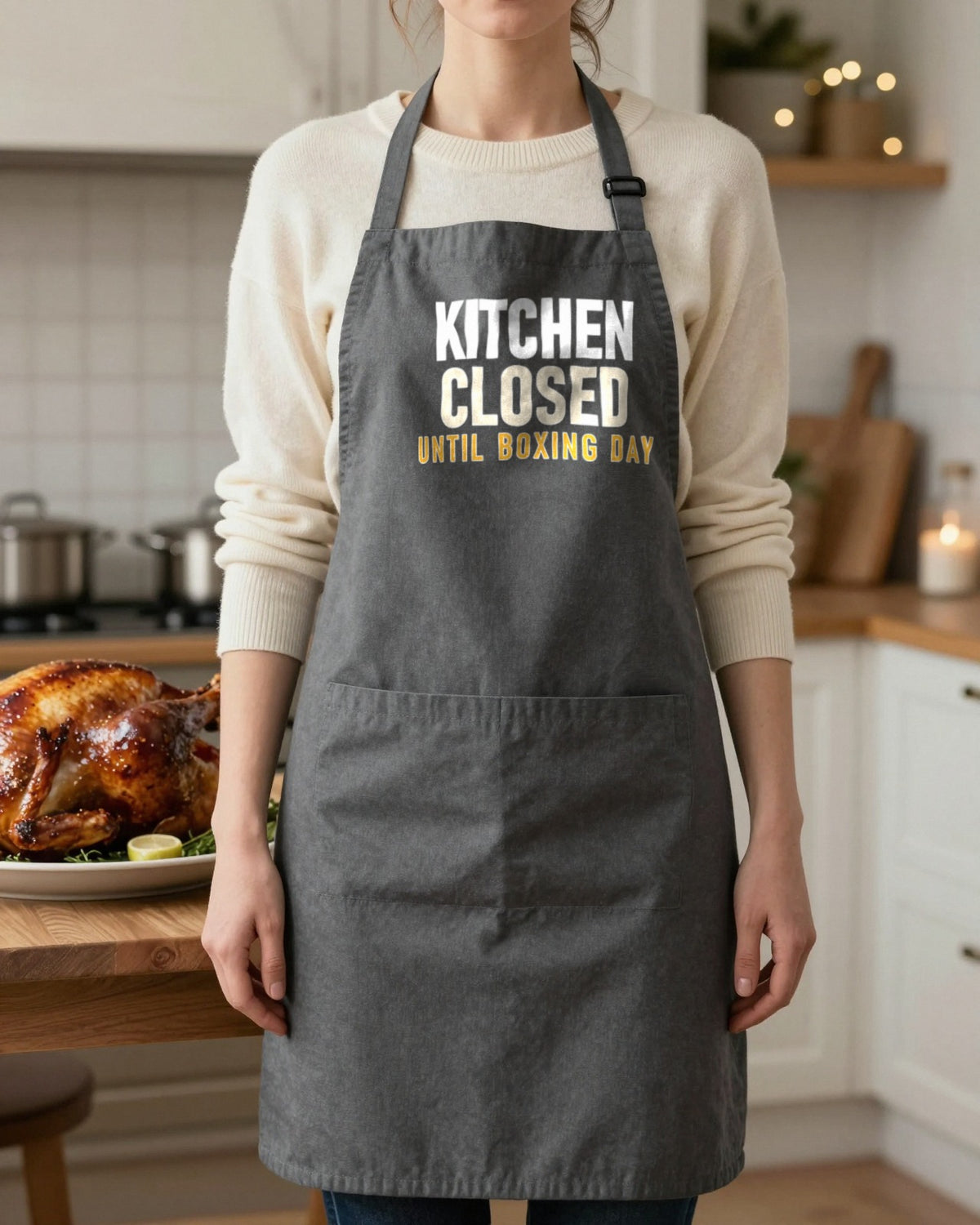 Kitchen Closed Until Boxing Day Christmas apron in Dark Grey, worn, our photo