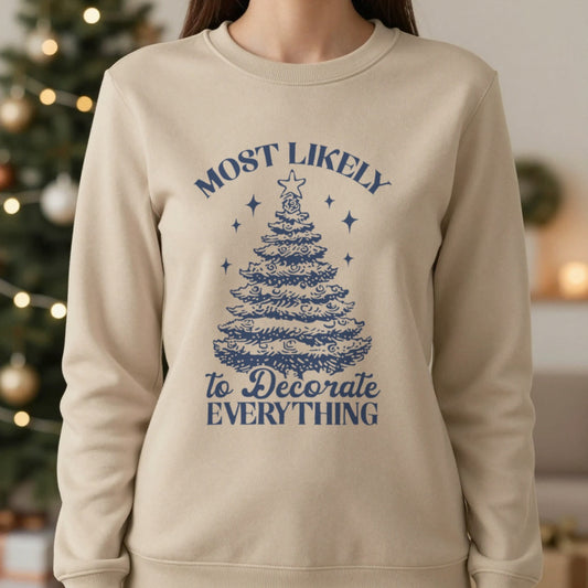 Most Likely To Decorate Everything Christmas Sweatshirt in Sand, worn, our photo