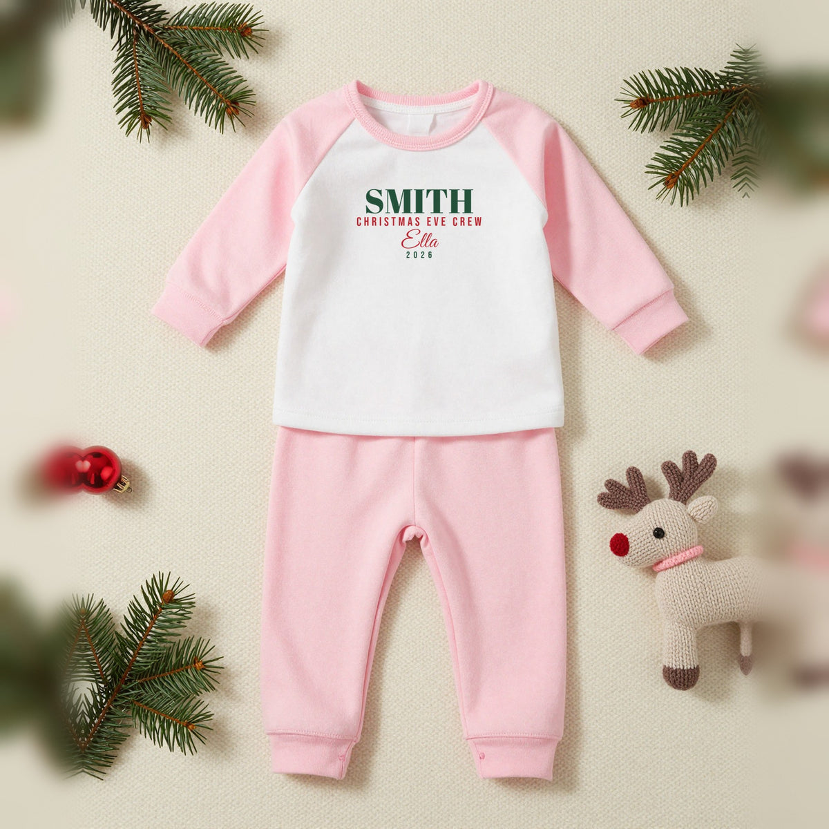 Christmas Eve Crew Personalised Matching Family Christmas Pyjamas Set, Baby & Toddler in Pink, our photo