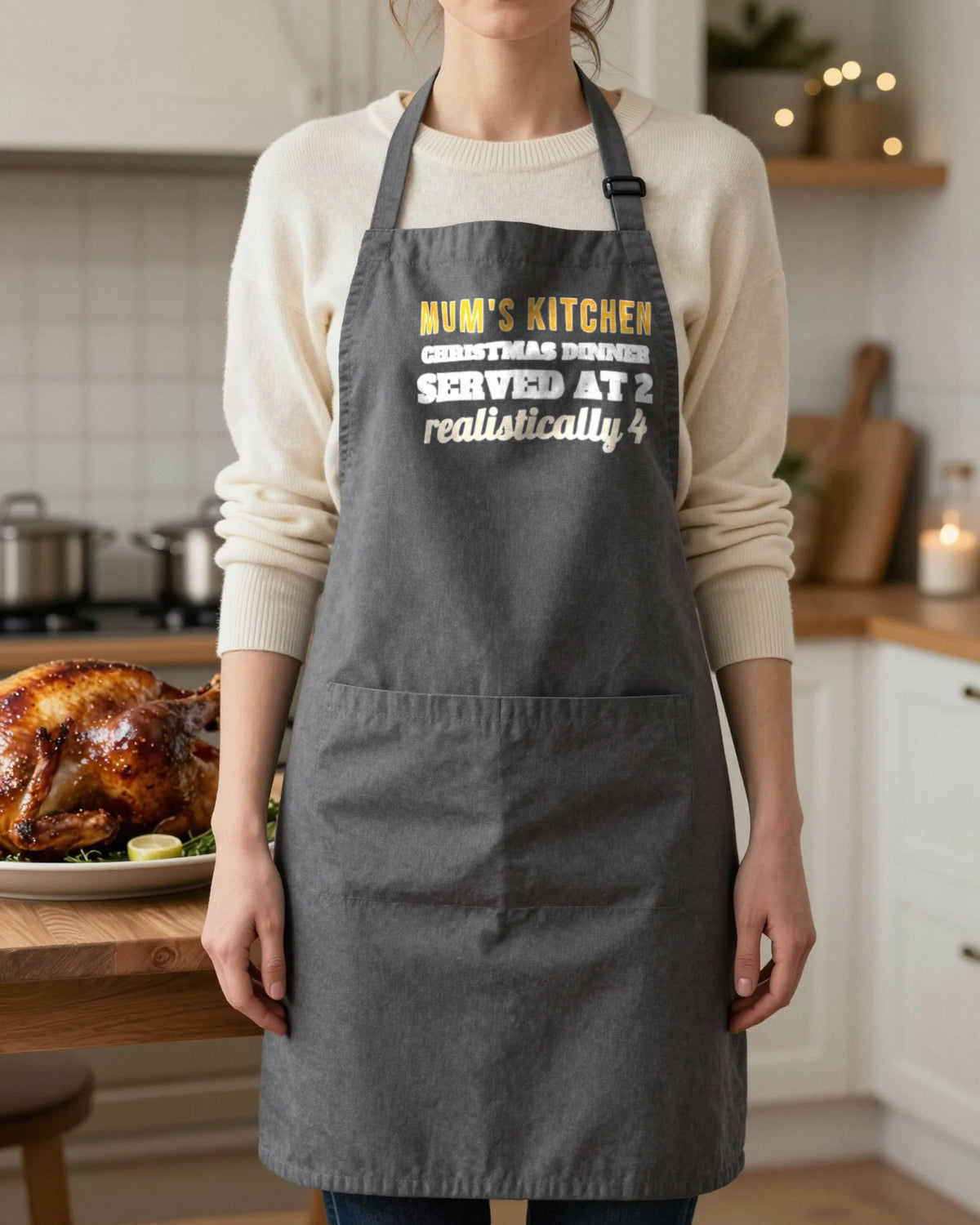 Name's Kitchen Christmas Dinner Served At 2 Christmas apron in Dark Grey, worn, our photo