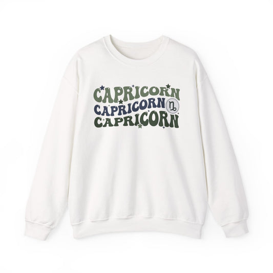 sand coloured sweatshirt with groovy Capricorn zodiac graphic and retro typography