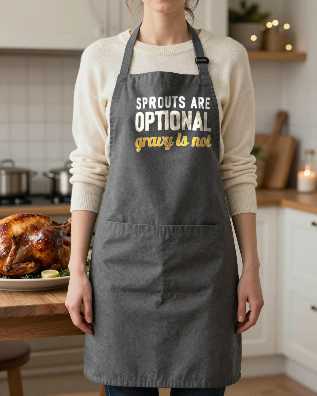 Sprouts Are Optional Gravy Is Not Christmas apron in Dark Grey, worn, our photo