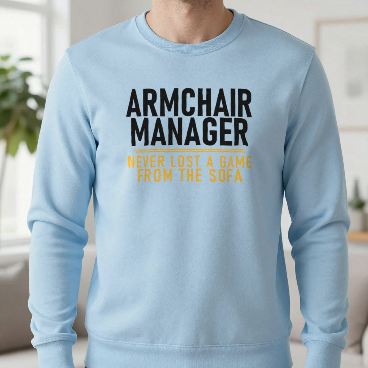 Armchair Manager Never Lost A Game From The Sofa Funny Football T-Shirt & Sweatshirt in Light Blue, worn, our photo