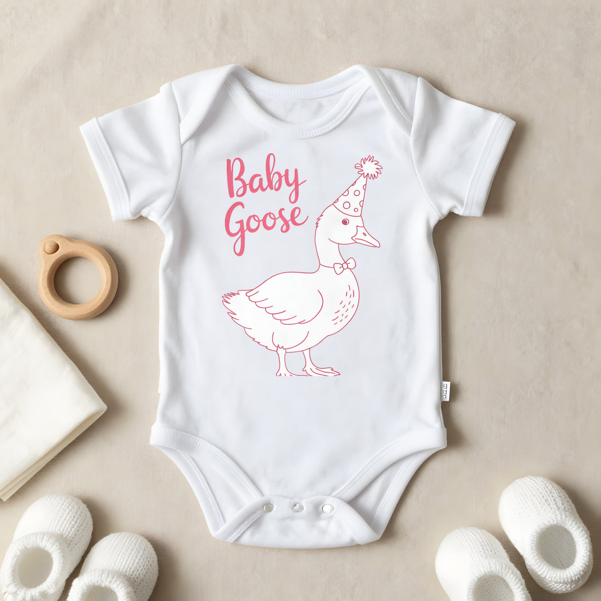 Baby Goose baby grow laid flat
