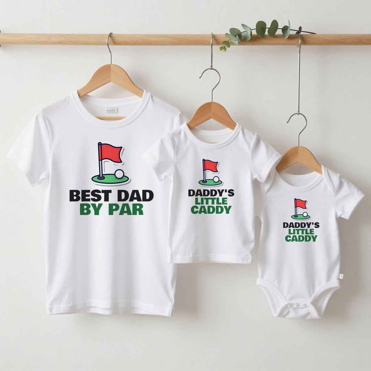Best Dad By Par & Daddy's Little Caddy Golf matching set grown-up tee, kids tee and baby grow on hangers