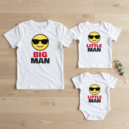 Big Man & Little Man matching set flat lay on oak floor: grown-up tee, kids tee and baby grow
