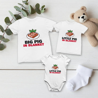 Big Pig & Little Pig in Blanket Christmas matching set flat lay with kids tee