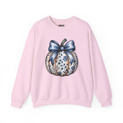 light pink sweatshirt with blue bow pumpkin design — coquette autumn gift for her