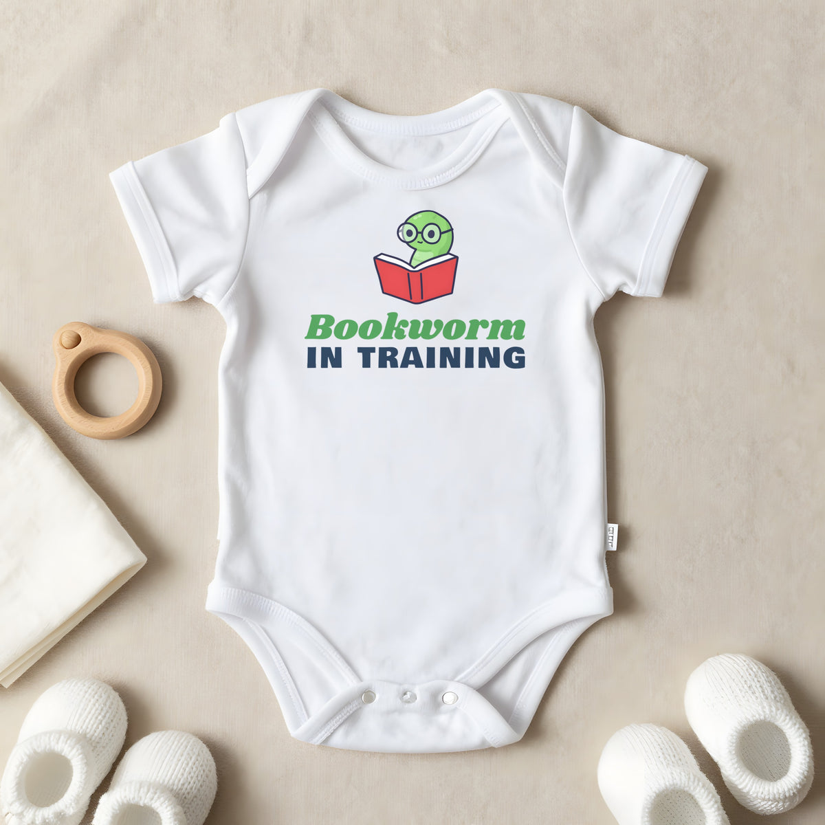 Bookworm In Training baby grow laid flat