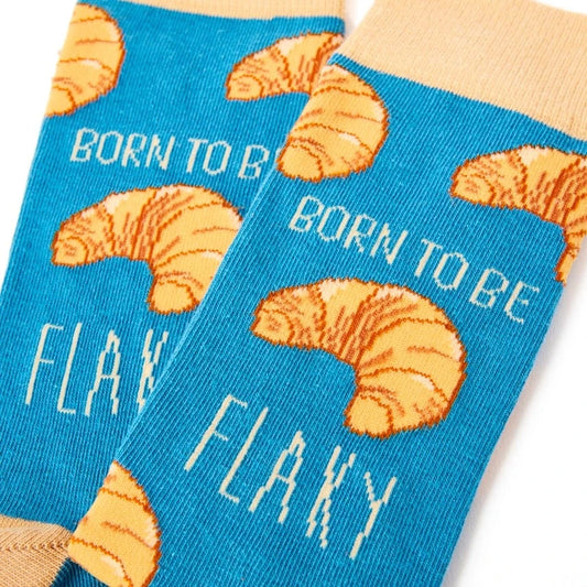 blue socks with born to be flaky croissant print funny foodie design
