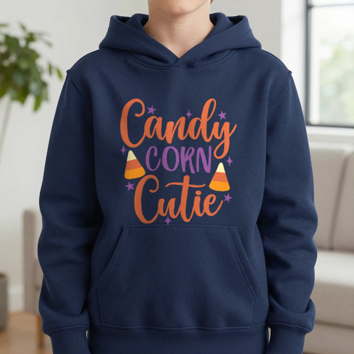 Candy Corn Cutie Halloween Kids Hoodie in Navy, worn, our photo