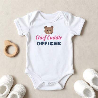 Chief Cuddle Officer baby grow laid flat