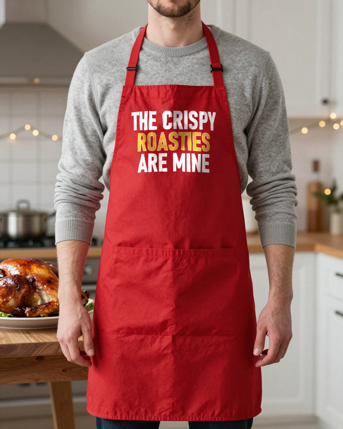 Crispy Roasties Are Mine Christmas apron in Red, worn, our photo