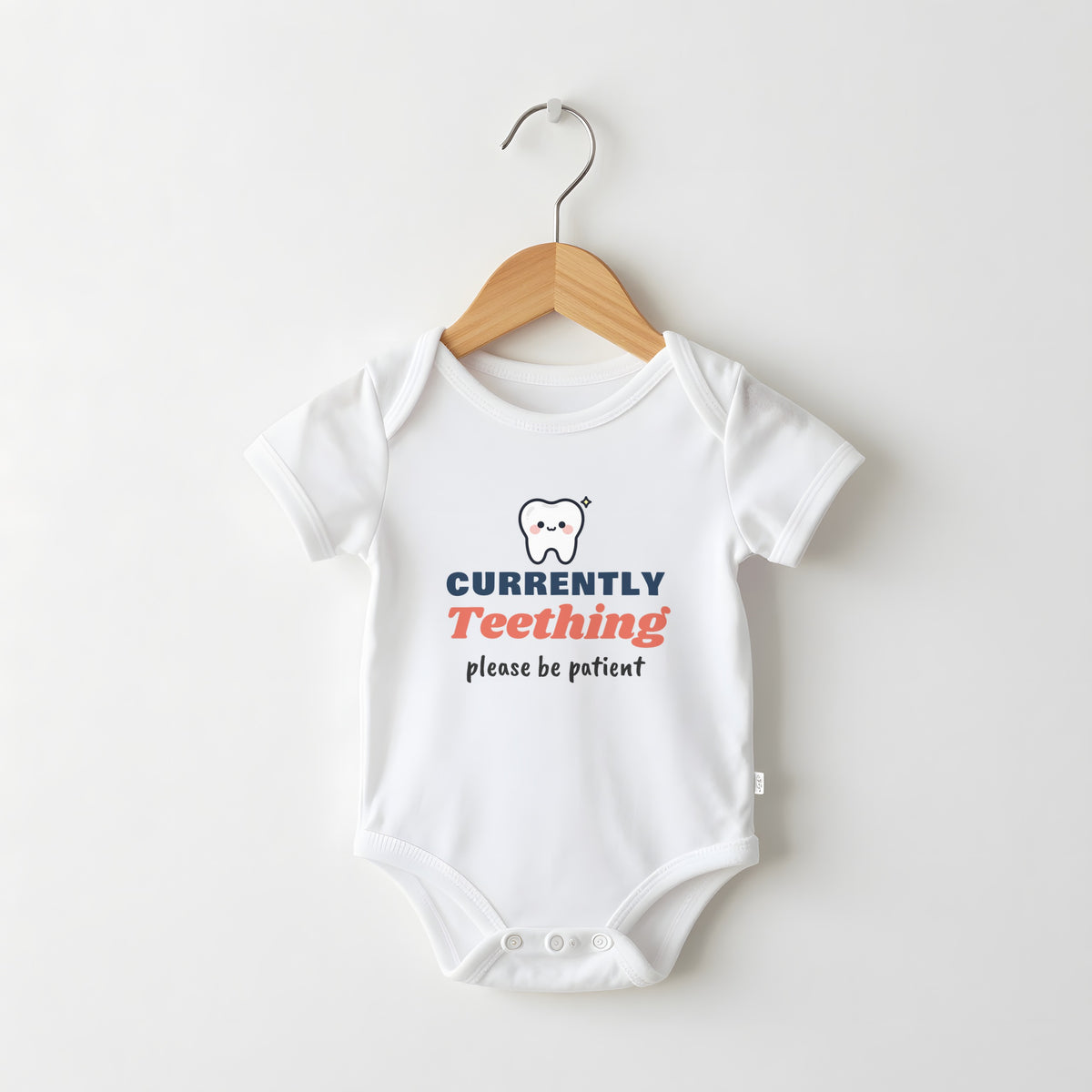Currently Teething white baby grow on a hanger