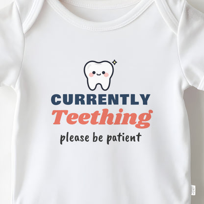 Currently Teething baby grow print close-up