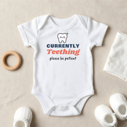 Currently Teething baby grow laid flat