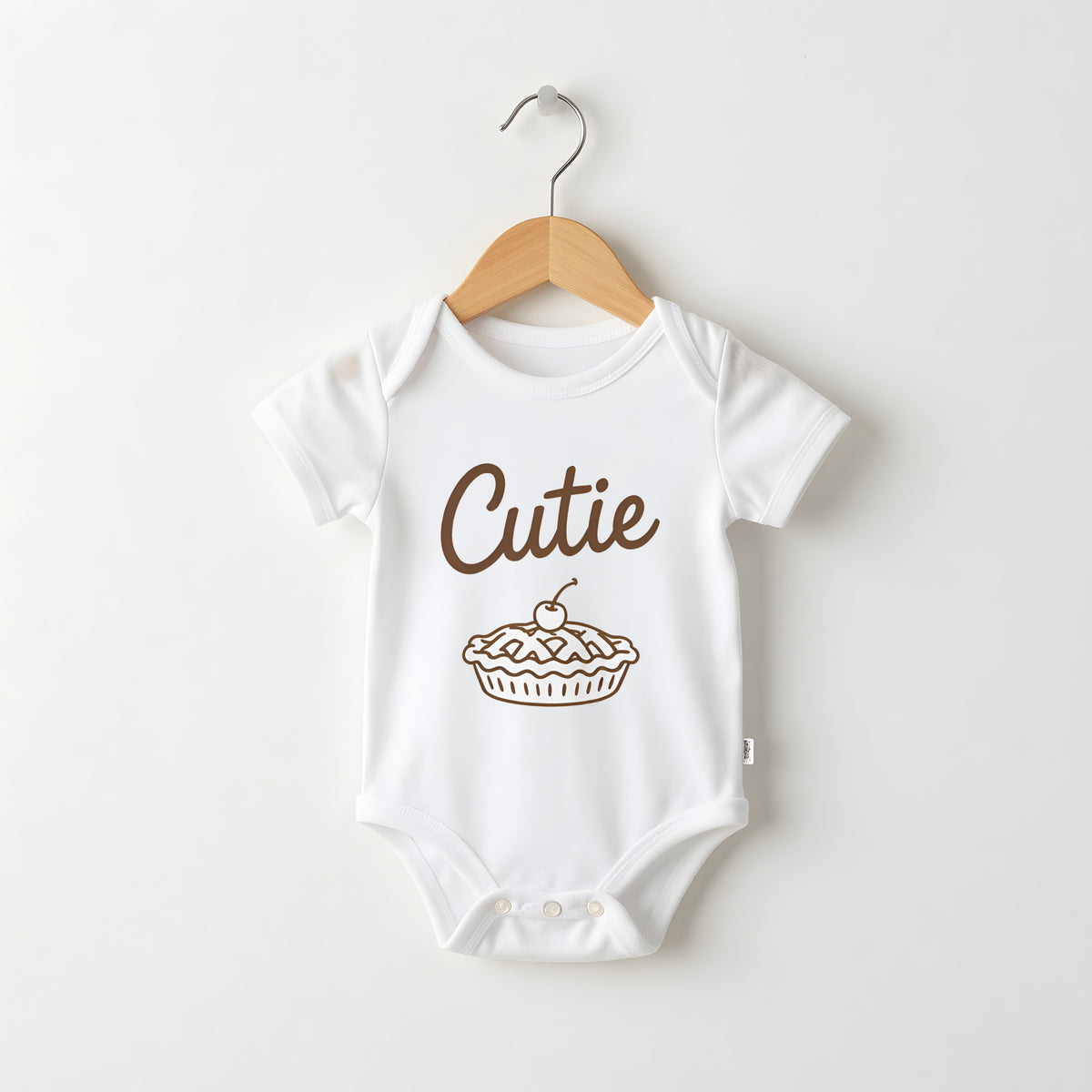 Cutie Pie white baby grow on a hanger