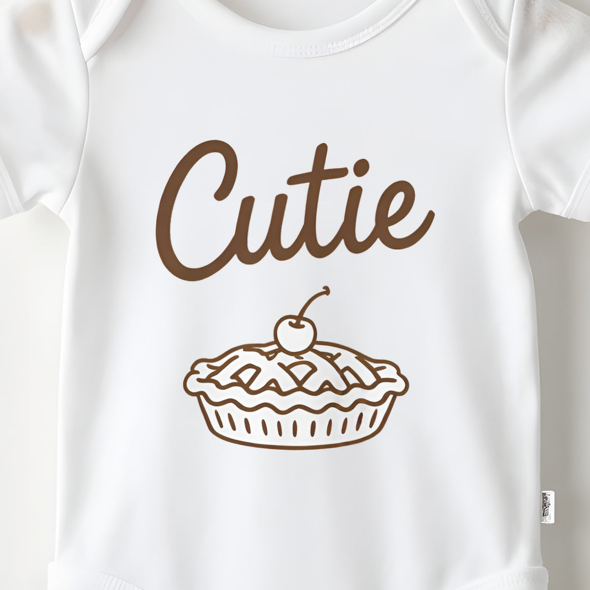 Cutie Pie baby grow print close-up