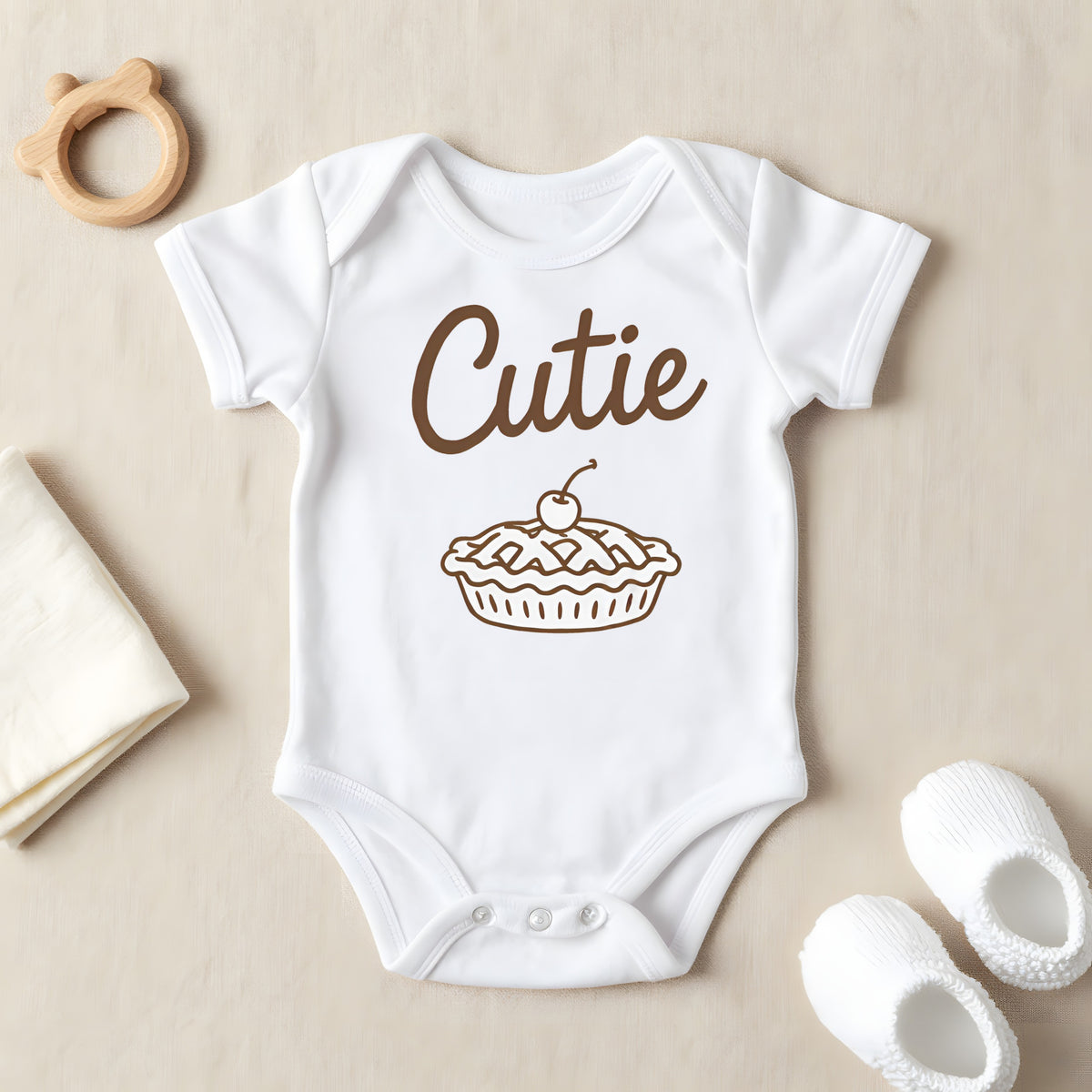 Cutie Pie baby grow laid flat