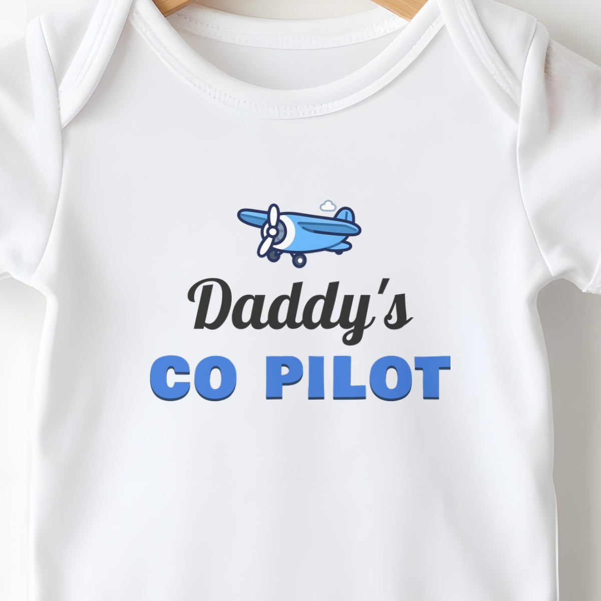 Daddy's Co-Pilot baby grow print close-up