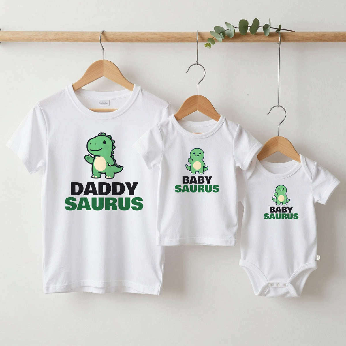 Daddysaurus & Babysaurus matching set grown-up tee, kids tee and baby grow on hangers