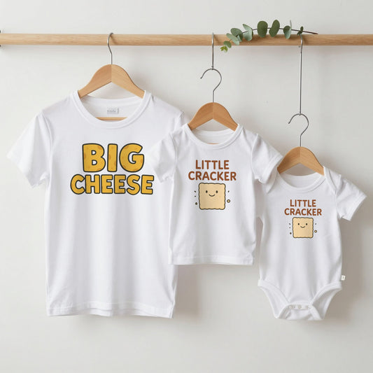 Big Cheese & Little Cracker grown-up tee, kids tee and baby grow on hangers