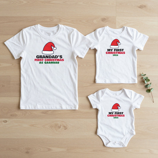 Grandad's First Christmas & My First Christmas matching set flat lay on oak floor: grown-up tee, kids tee and baby grow