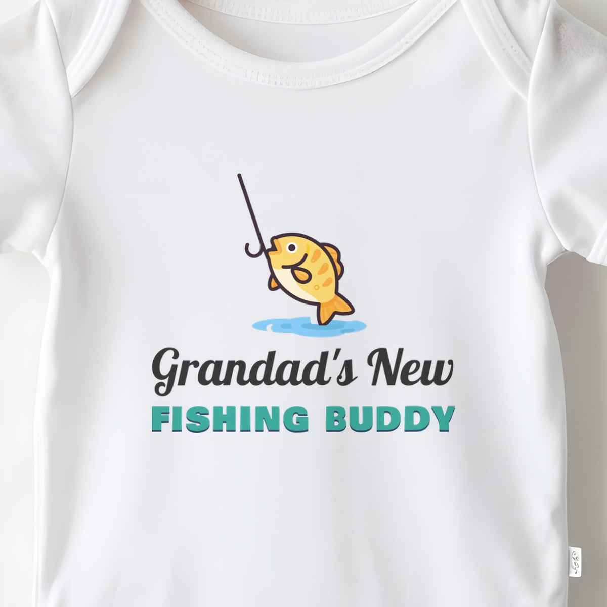 Grandad's New Fishing Buddy baby grow print close-up