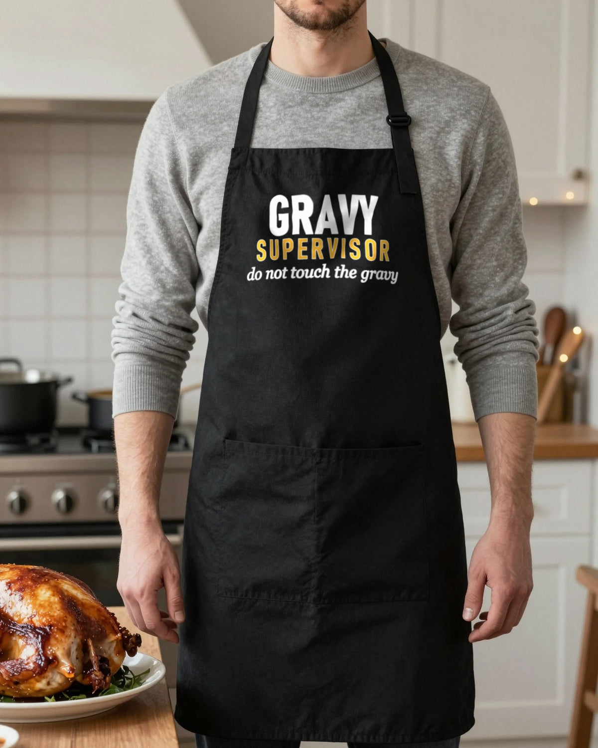 Gravy Supervisor Do Not Touch The Gravy Christmas apron in Black, worn, our photo