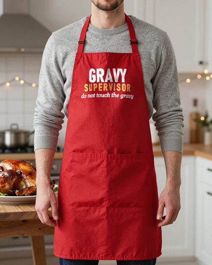 Gravy Supervisor Do Not Touch The Gravy Christmas apron in Red, worn, our photo