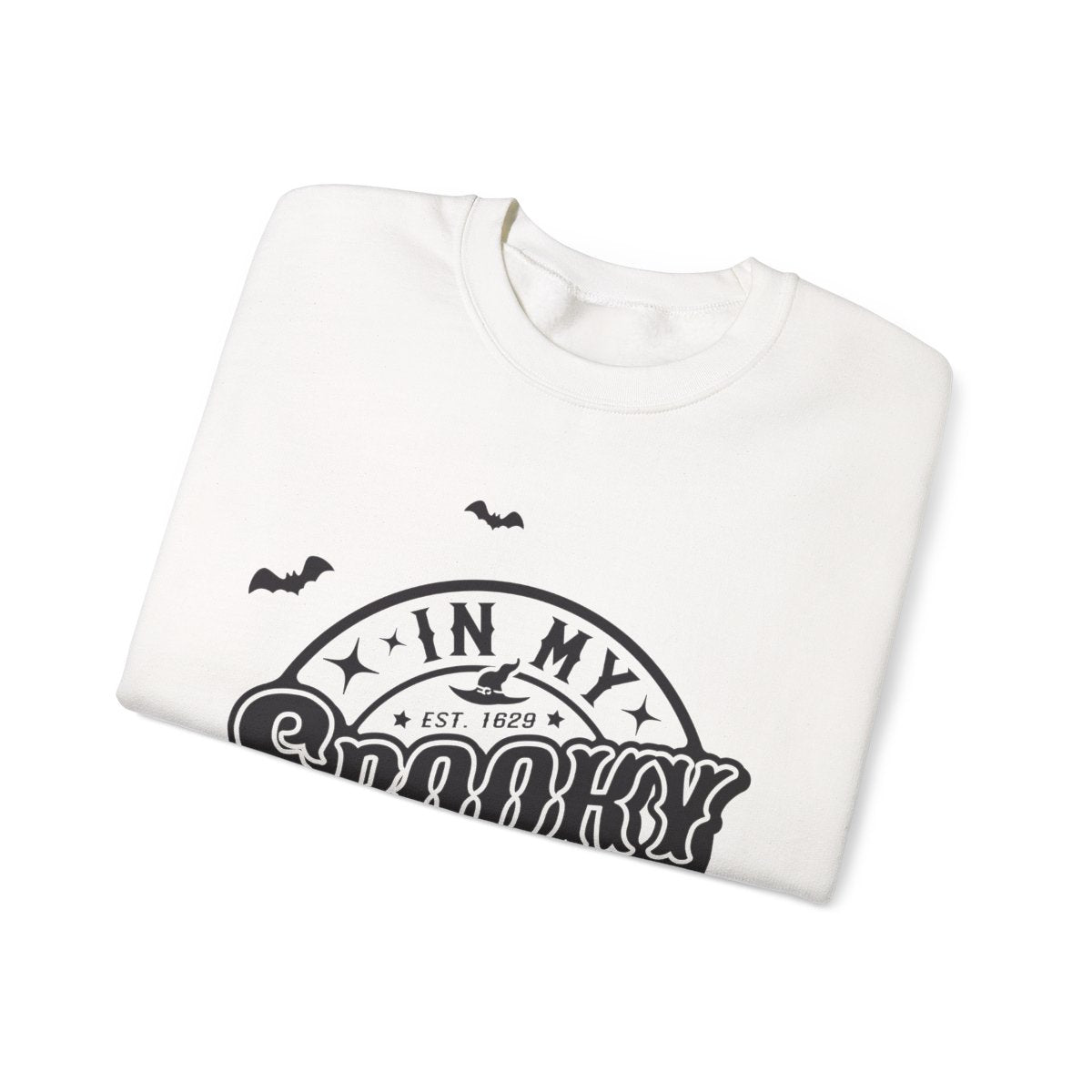 close up detail of spooky bitch era retro bat and star design on sweatshirt