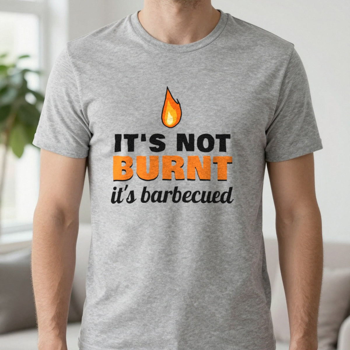 It's Not Burnt It's Barbecued Funny BBQ T-Shirt & Sweatshirt in Sport Grey (T-Shirt), worn, our photo