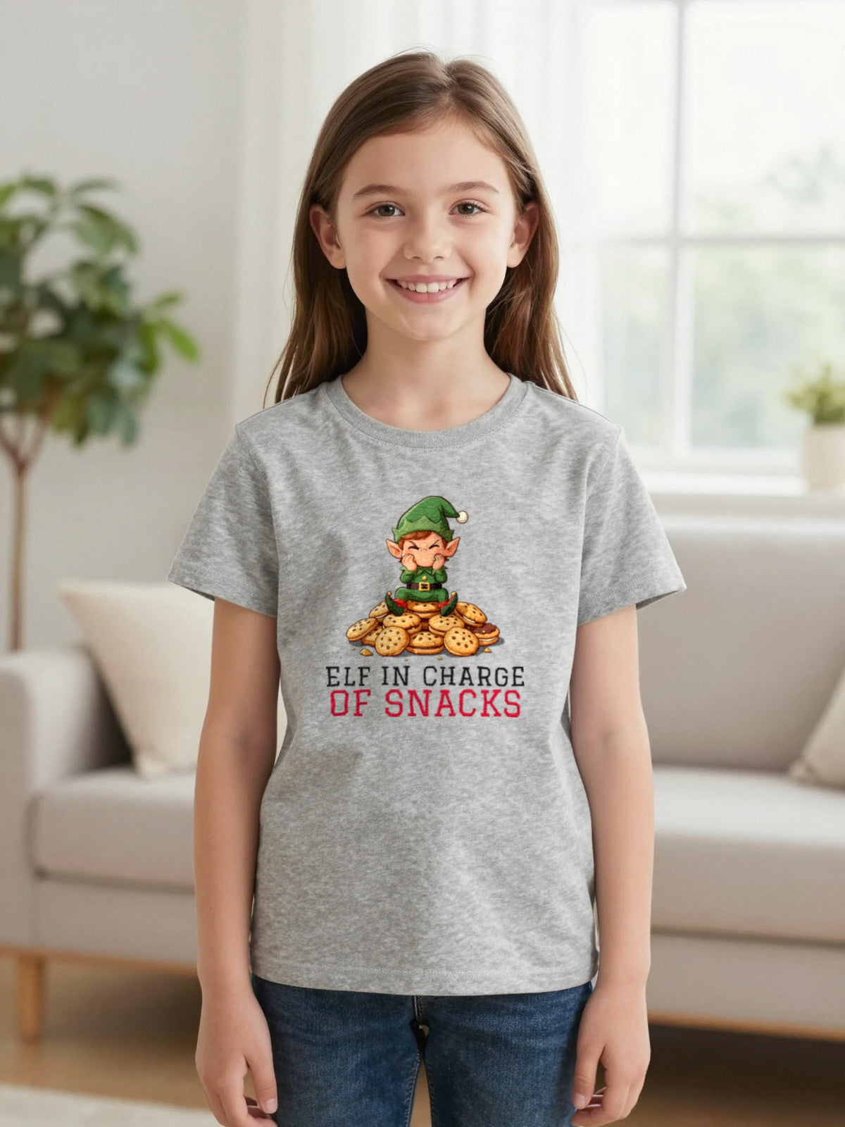 Kids Elf In Charge Of Snacks Christmas T-Shirt & Jumper worn by a child