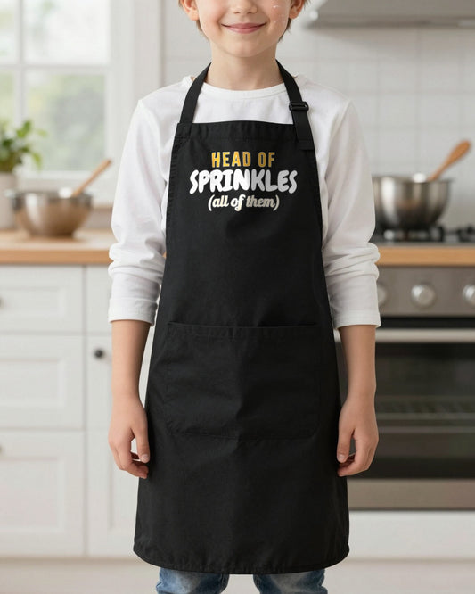 Head Of Sprinkles kids apron in Black, worn, our photo