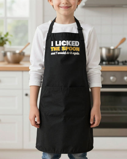 I Licked The Spoon kids apron in Black, worn, our photo