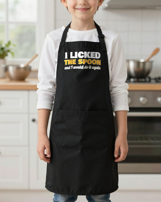 I Licked The Spoon kids apron in Black, worn, our photo
