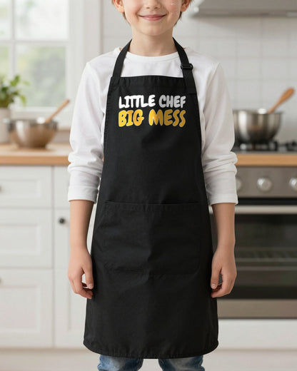 Little Chef Big Mess kids apron in Black, worn, our photo