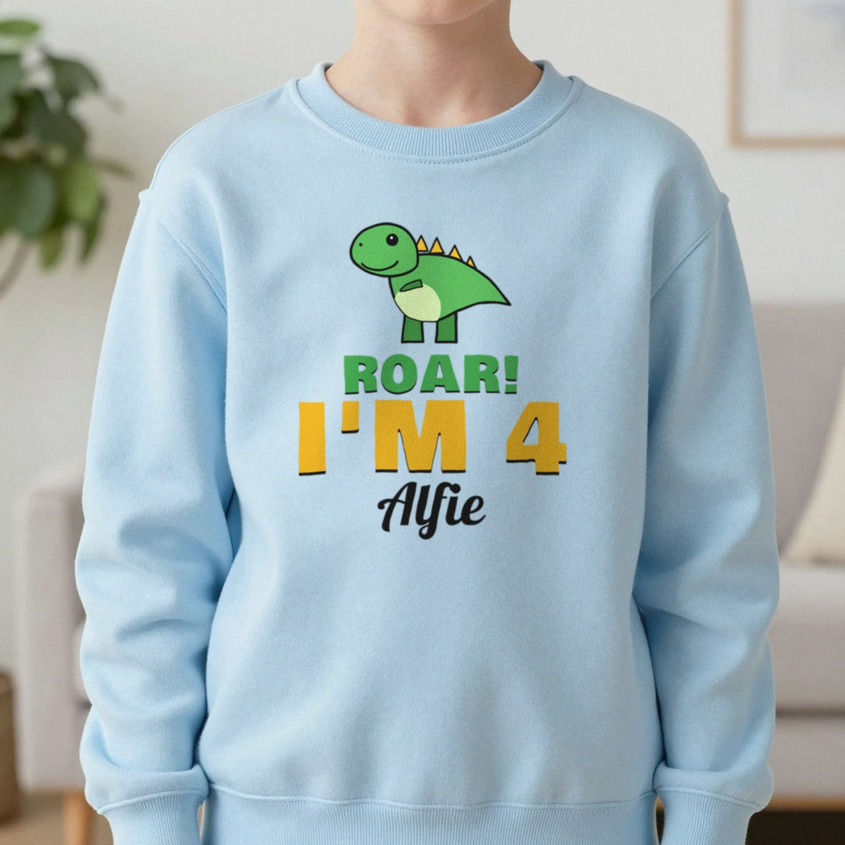 Kids Personalised Dinosaur Birthday T-Shirt Sweatshirt in Light Blue, worn, our photo