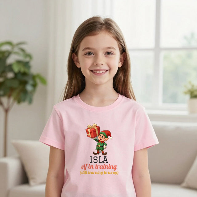 Kids Personalised Elf In Training Christmas T-Shirt & Sweatshirt | Name Elf in training (still learning to wrap)