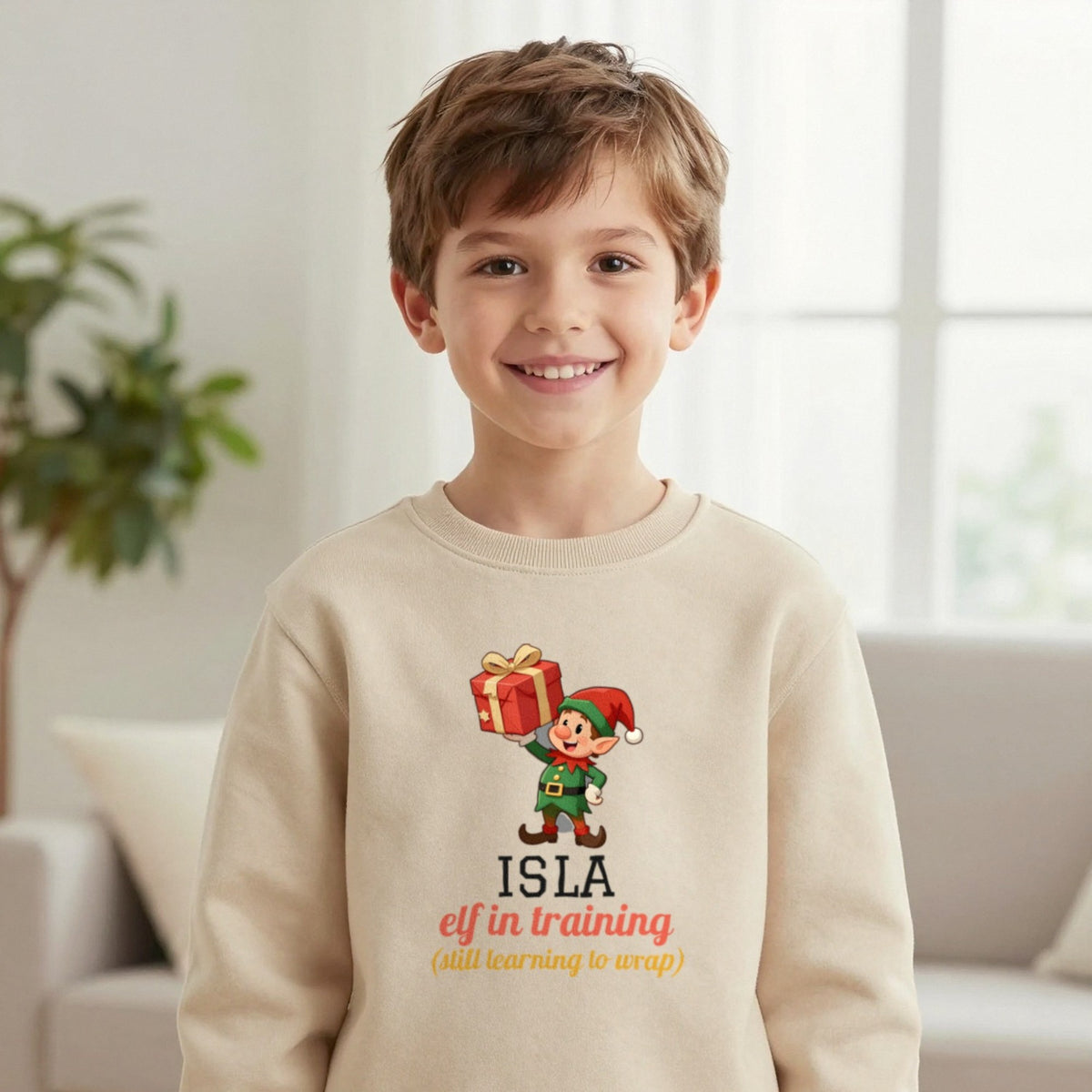 Kids Personalised Elf In Training Christmas T-Shirt & Sweatshirt Sweatshirt in Sand, worn, our photo