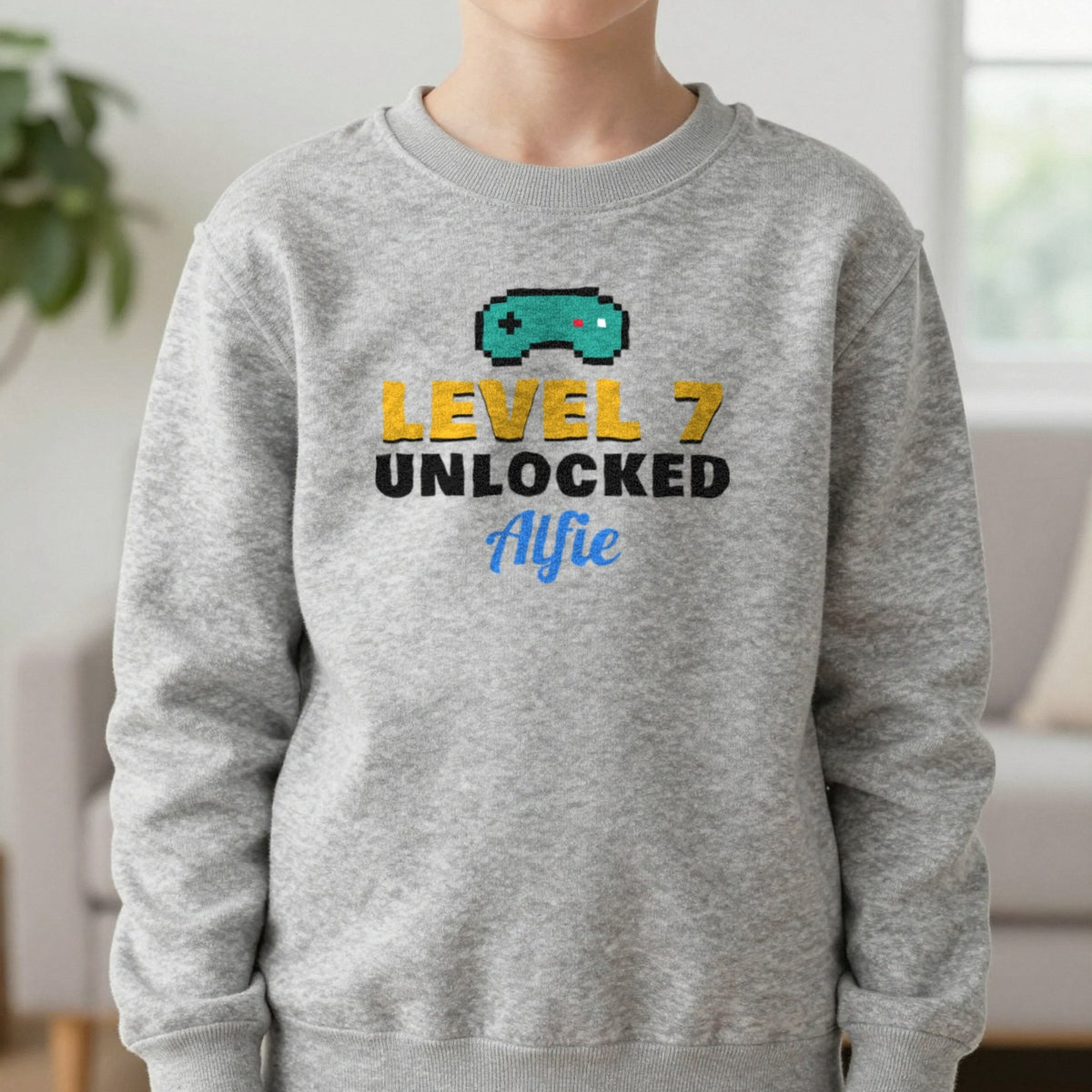 Kids Personalised Level Unlocked Birthday T-Shirt & Sweatshirt Sweatshirt in Sport Grey, worn, our photo