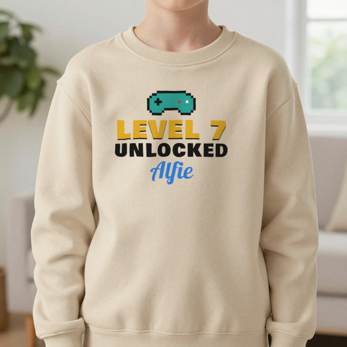 Kids Personalised Level Unlocked Birthday T-Shirt & Sweatshirt Sweatshirt in Sand, worn, our photo
