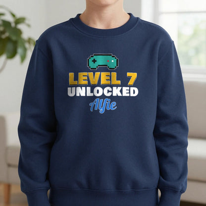 Kids Personalised Level Unlocked Birthday T-Shirt & Sweatshirt Sweatshirt in Navy, worn, our photo