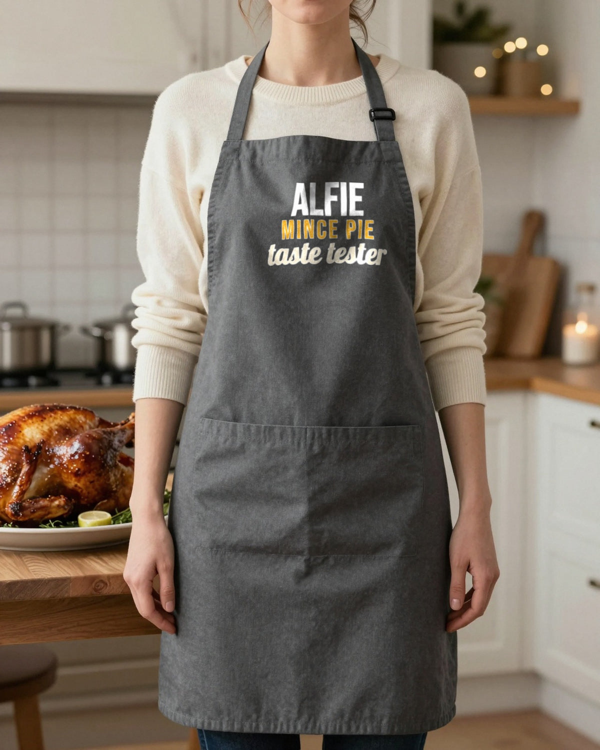 Kids Name Mince Pie Taste Tester Christmas apron in Dark Grey, worn, our photo