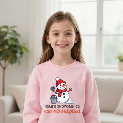 Kids Personalised Snowman Building Co Christmas T-Shirt & Sweatshirt Sweatshirt in Light Pink, worn, our photo