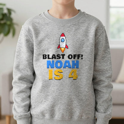 Kids Personalised Space Rocket Birthday T-Shirt Sweatshirt in Sport Grey, worn, our photo