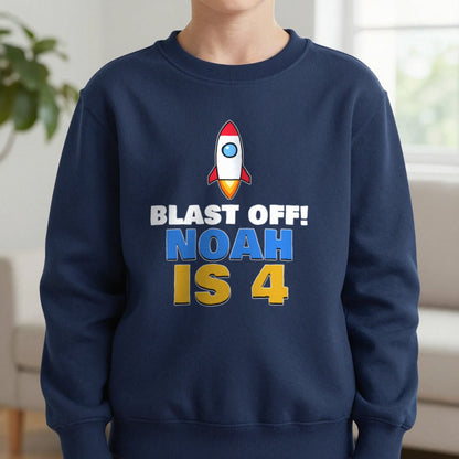 Kids Personalised Space Rocket Birthday T-Shirt Sweatshirt in Navy, worn, our photo