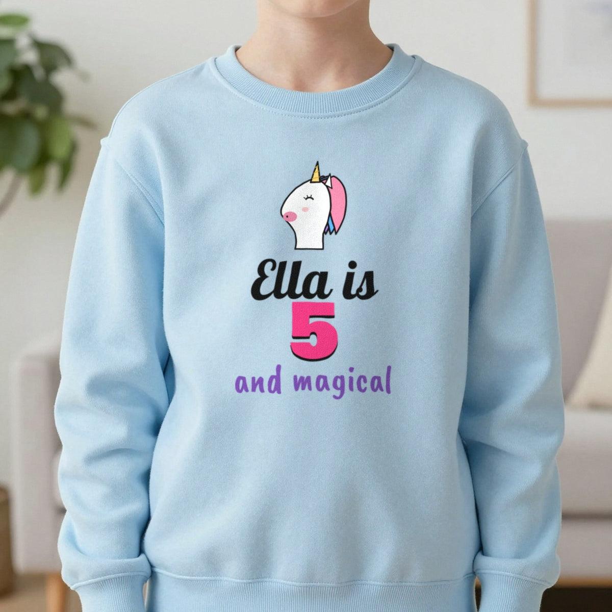 Kids Personalised Unicorn Birthday T-Shirt Sweatshirt in Light Blue, worn, our photo