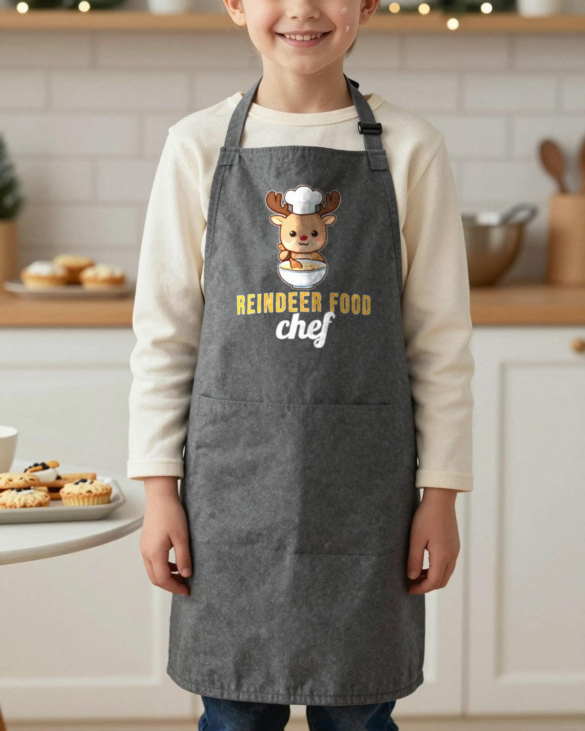Reindeer Food Chef kids apron in Dark Grey, worn, our photo